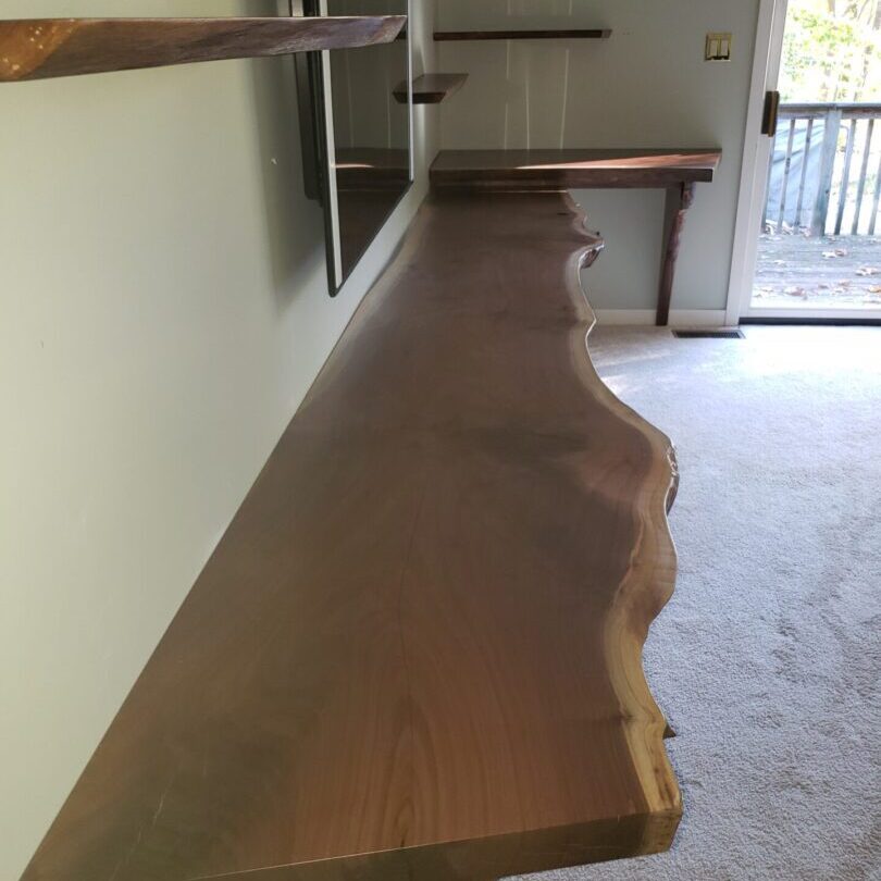 Live edge wooden shelf in modern room.